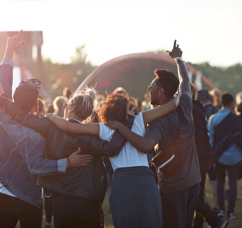 A diverse crowd at a music festival
