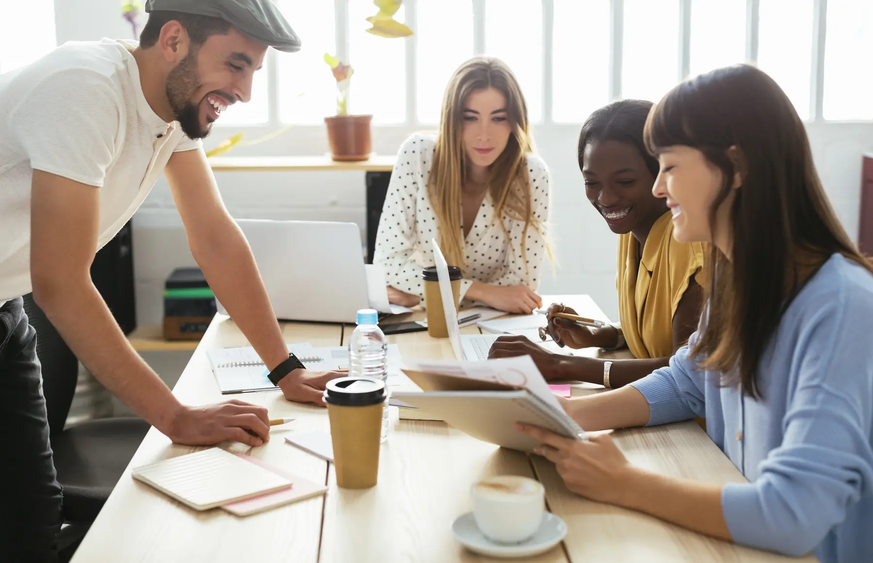 Colleagues working together around a table